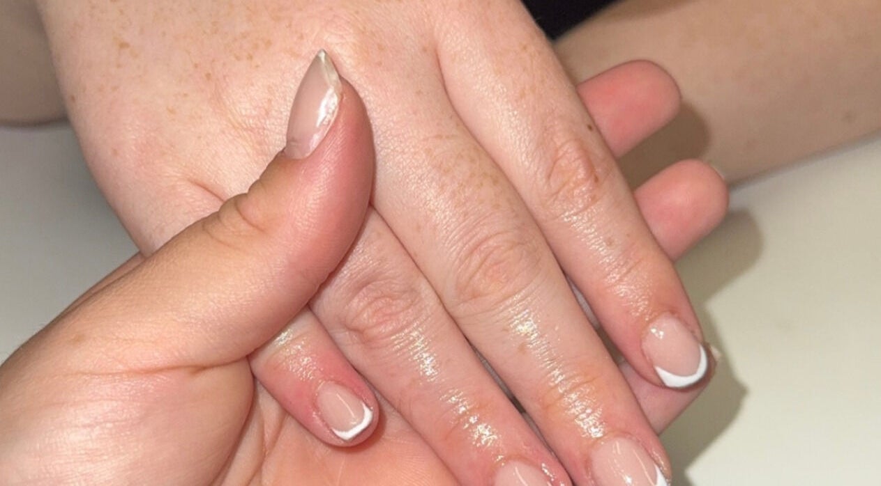 Freshly manicured nails at Beauté Bar, Dumfries, Scotland, GB, showcasing elegant nail art.