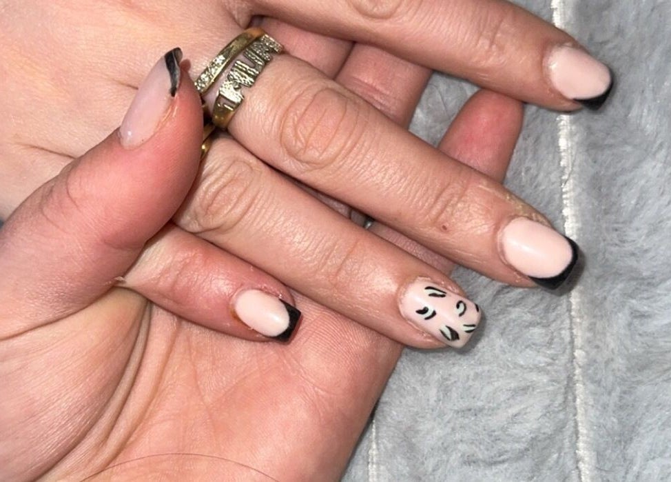 Stylish nail art with black tips at Beauté Bar, Dumfries, Scotland, GB.
