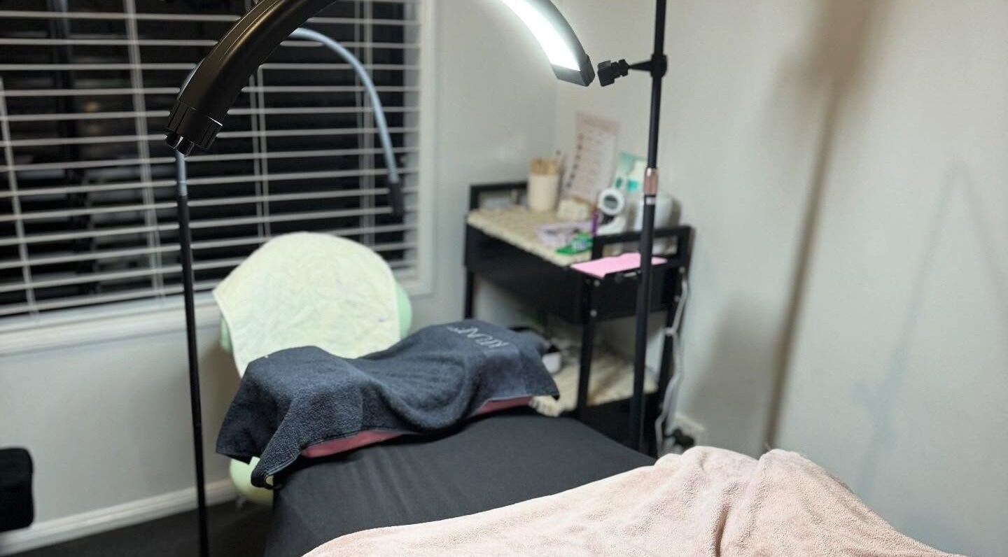 Tranquil beauty treatment room at Brow Bros & Co, Glenella, Queensland, AU with lighting and cozy setup.