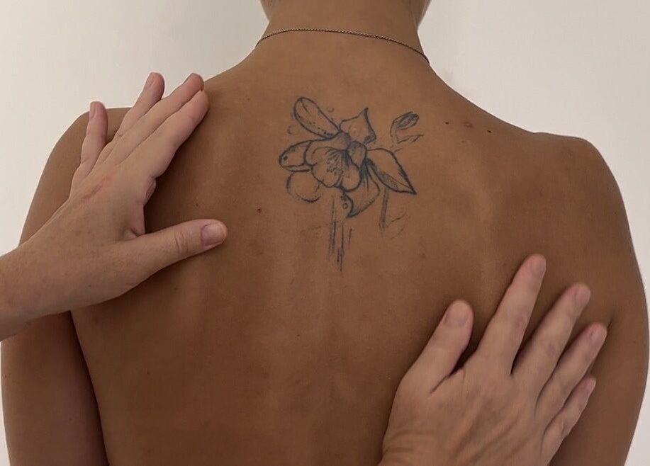 Back floral tattoo being admired at Sculptor By Aray Kairkanova Ladies Salon DUBAI MARINA, Dubai, Dubai, AE.