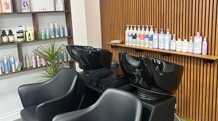 Stylish salon wash stations at L.E.V Hair & Beauty in Leicester, England, GB with premium hair care products.