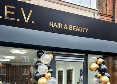 Elegant facade of L.E.V Hair & Beauty with balloon decor, Leicester, England, GB.