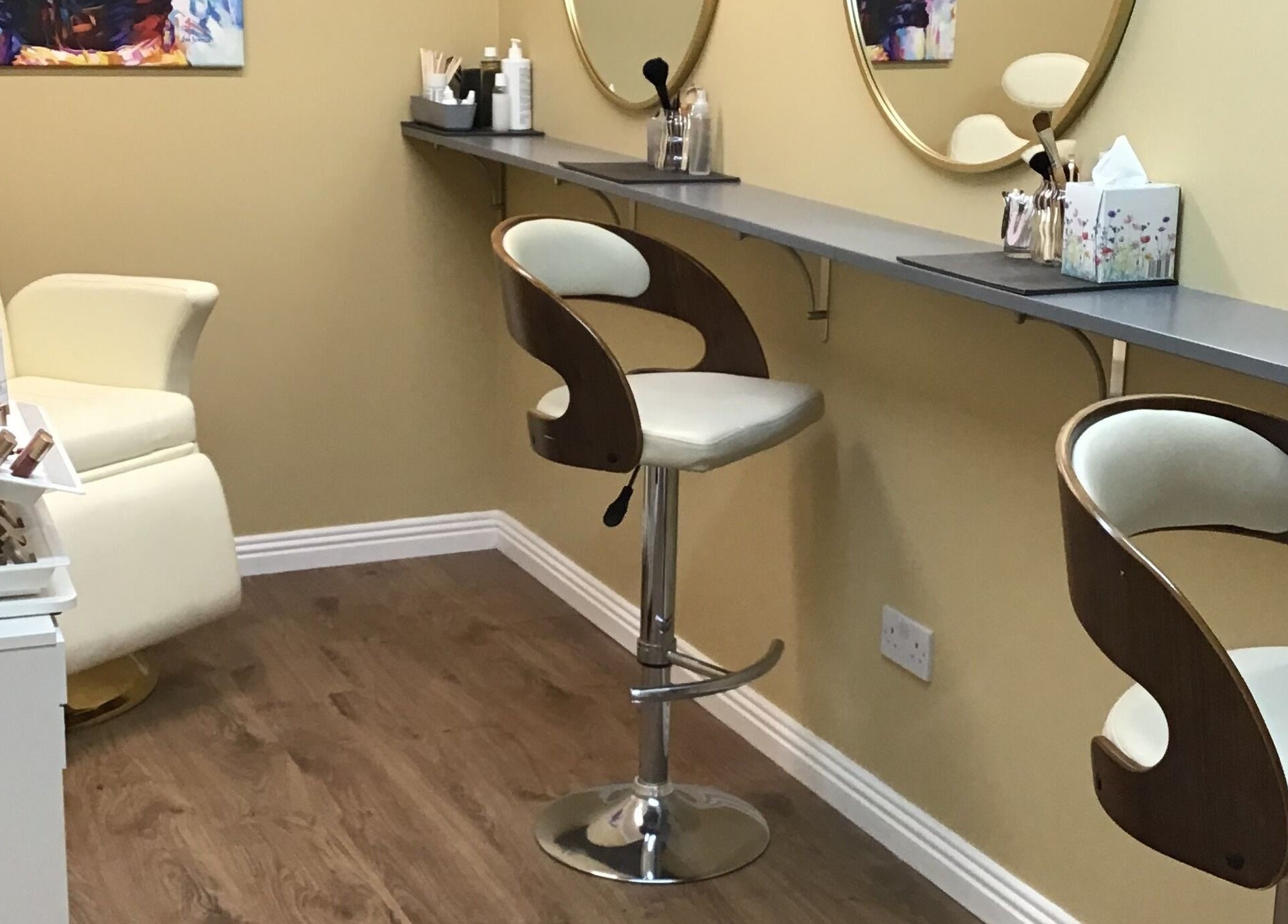 Makeup area at Visions Beauty Clinic, Galway, County Galway, IE with modern chairs and mirrors.
