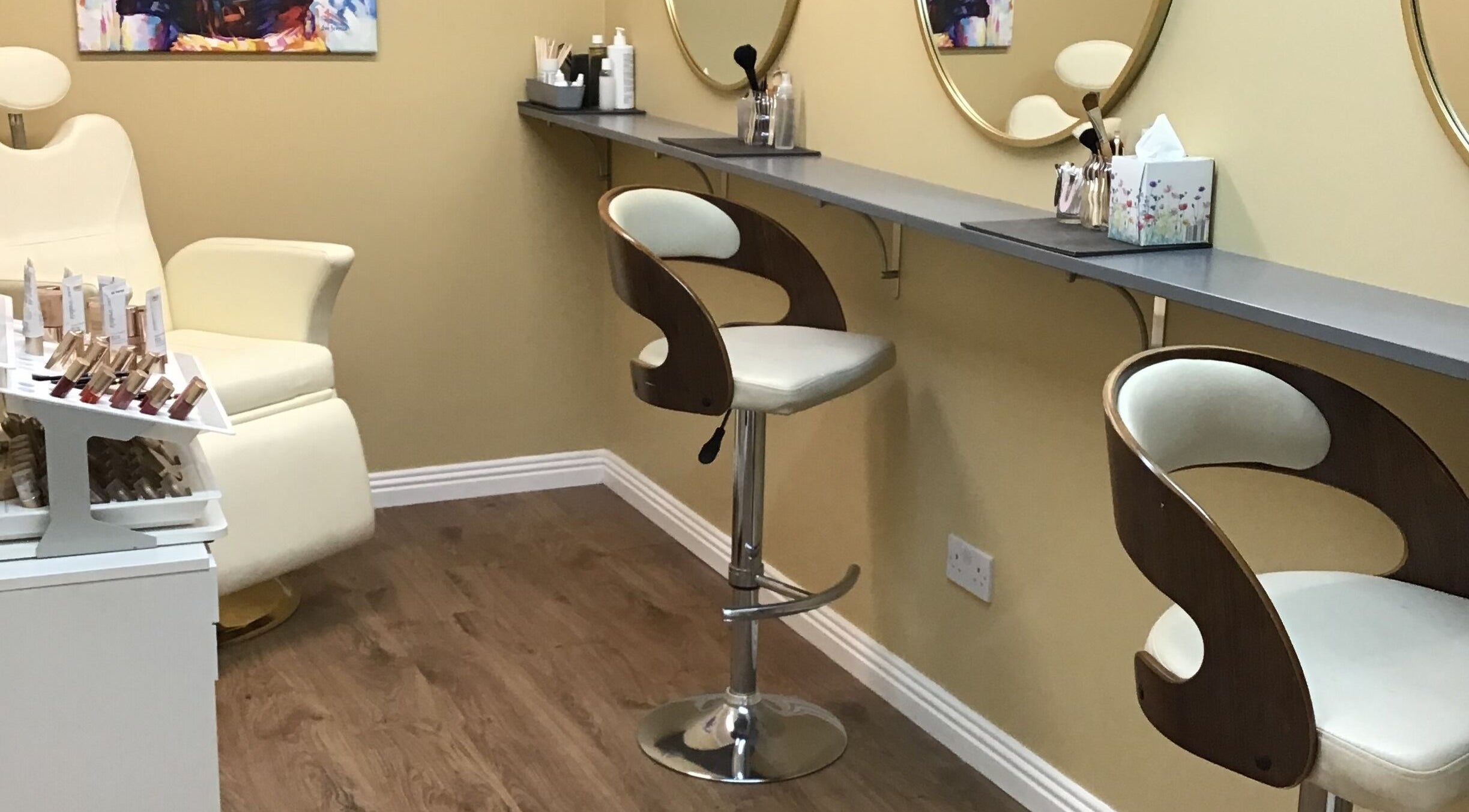 Makeup area at Visions Beauty Clinic, Galway, County Galway, IE with modern chairs and mirrors.