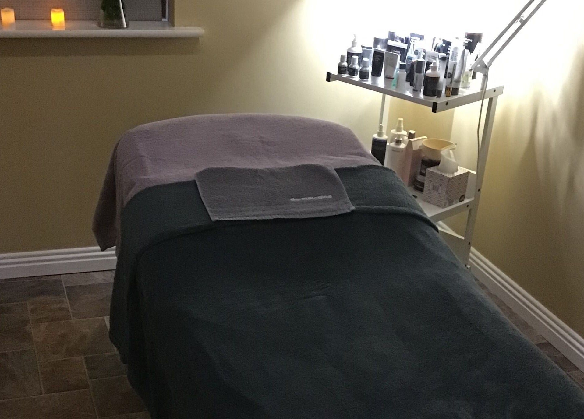 Relaxing treatment room at Visions Beauty Clinic, Galway, County Galway, IE, with a cozy table and products.