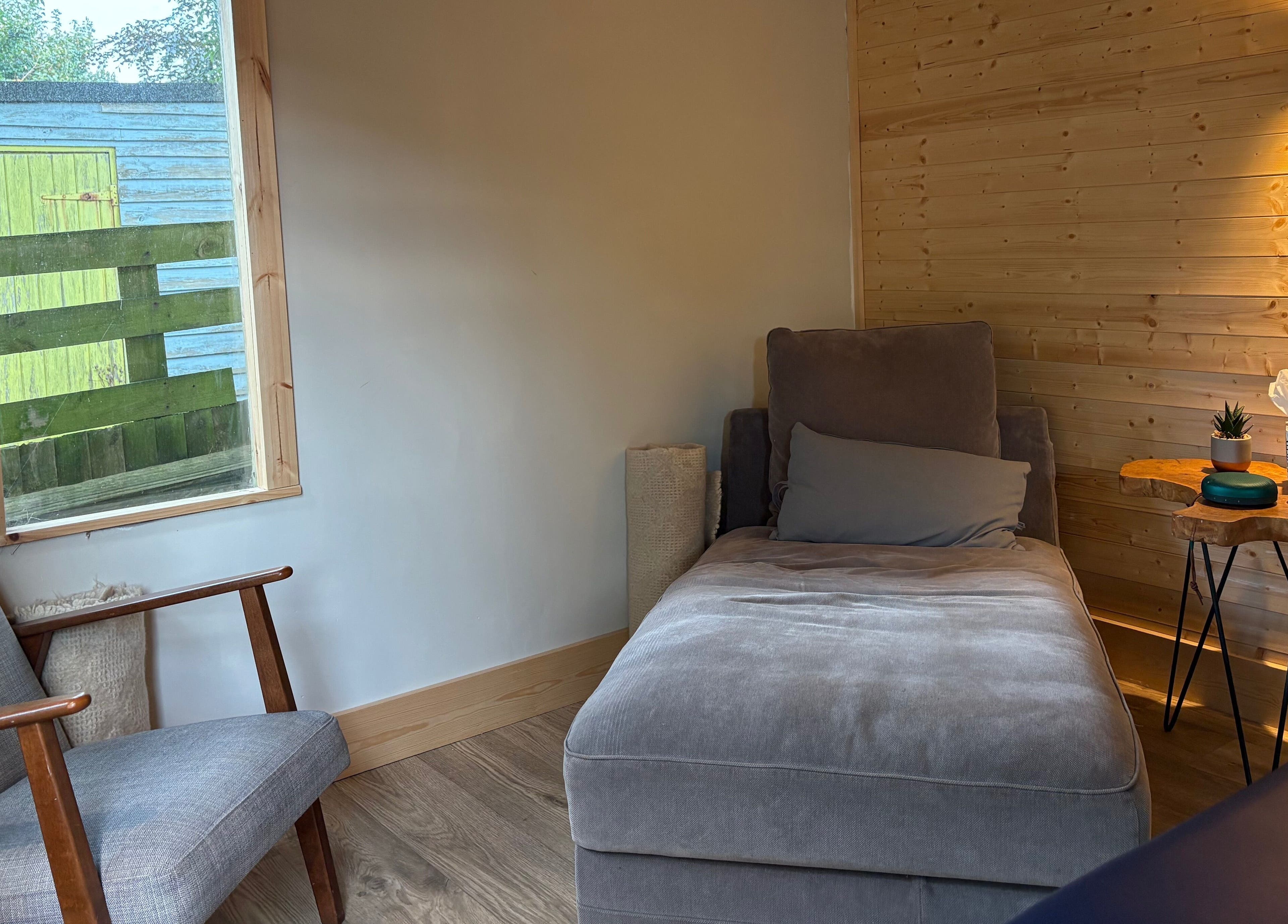 Relaxing lounge at Frequency Health, Saint Leonard’s on Sea, England, GB, featuring comfy seating and lighting.