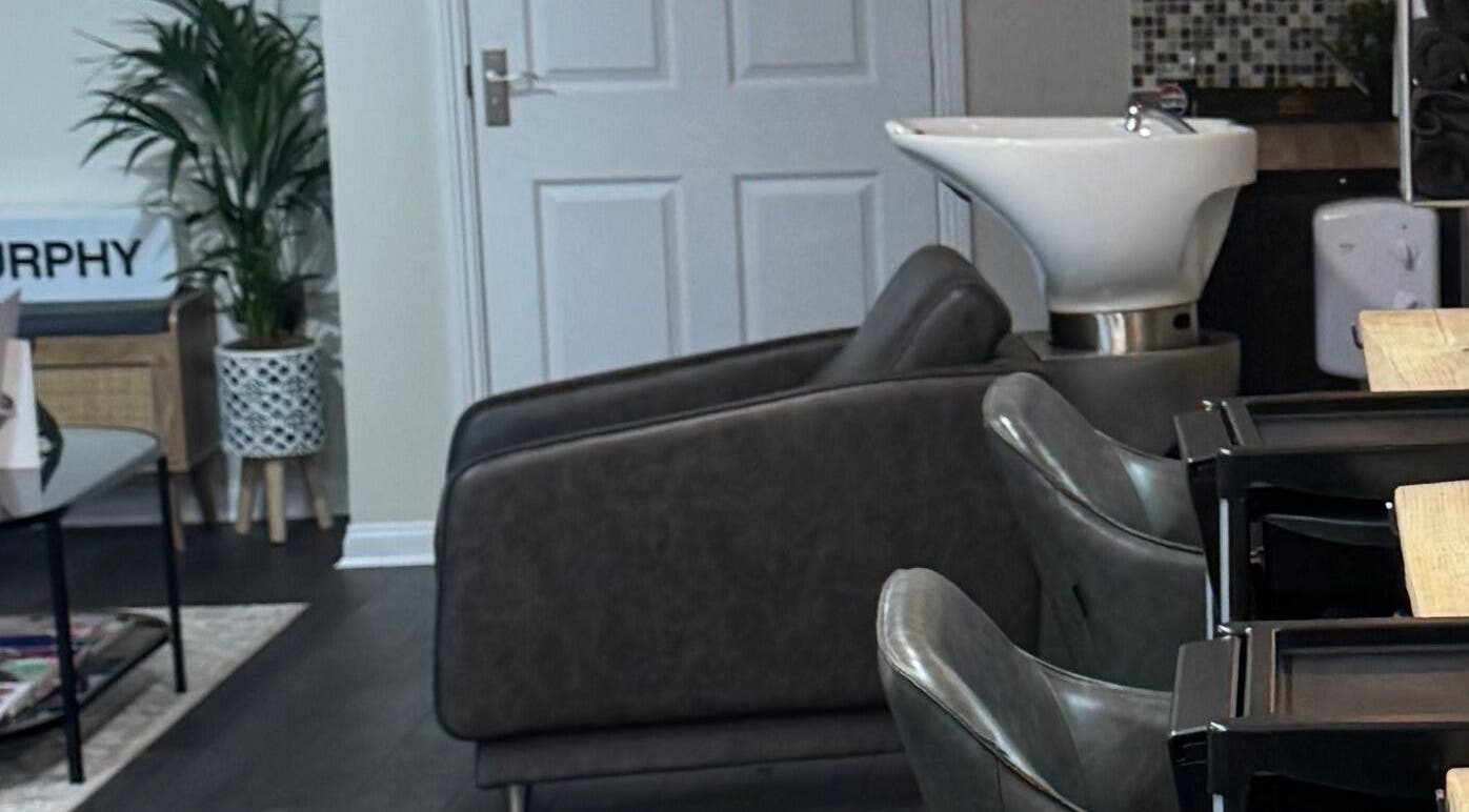Modern wash area with sleek chairs at South Beach Salon in Helston, England, GB.