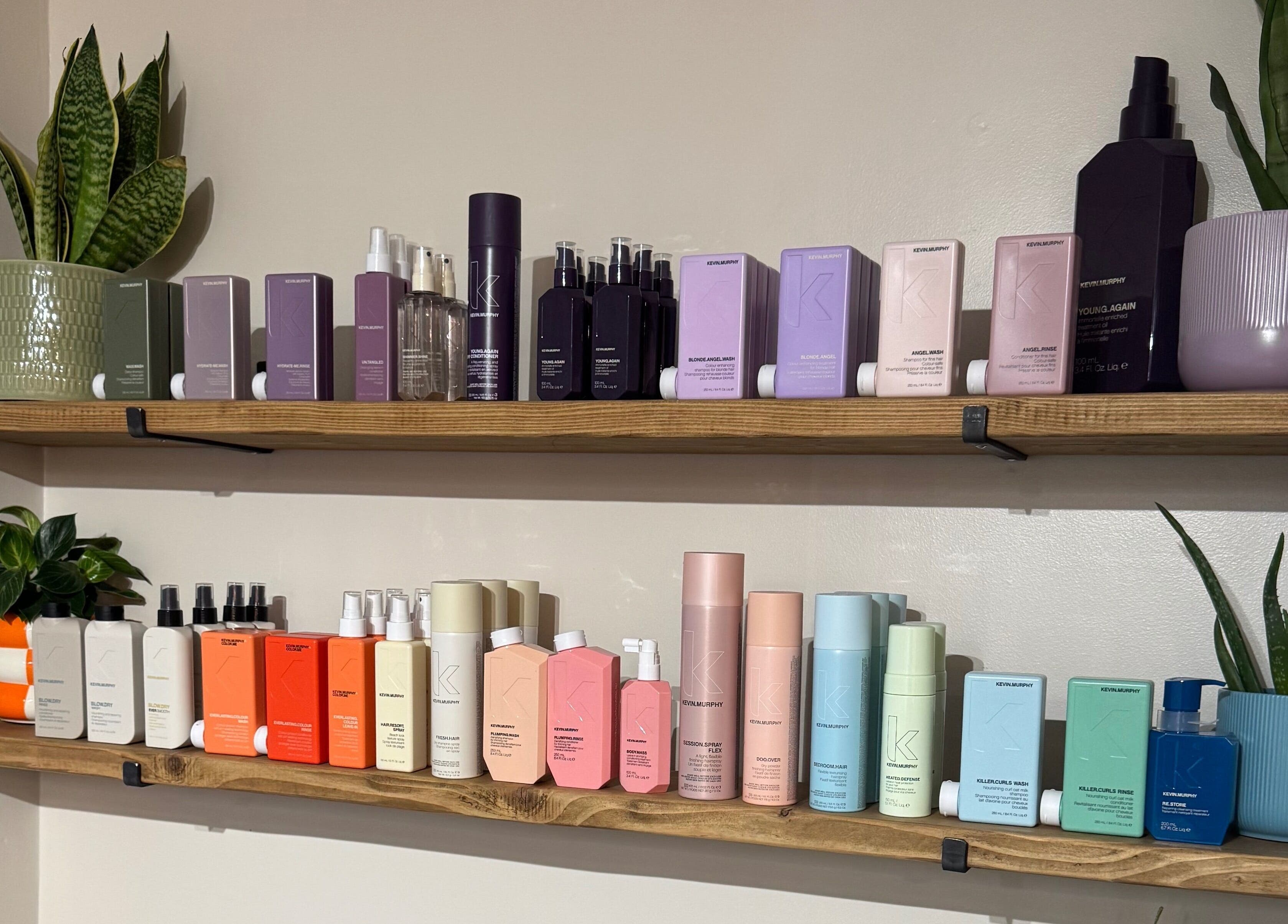 Stylish shelves of beauty products at South Beach Salon, Helston, England, GB, enhancing the serene ambiance.