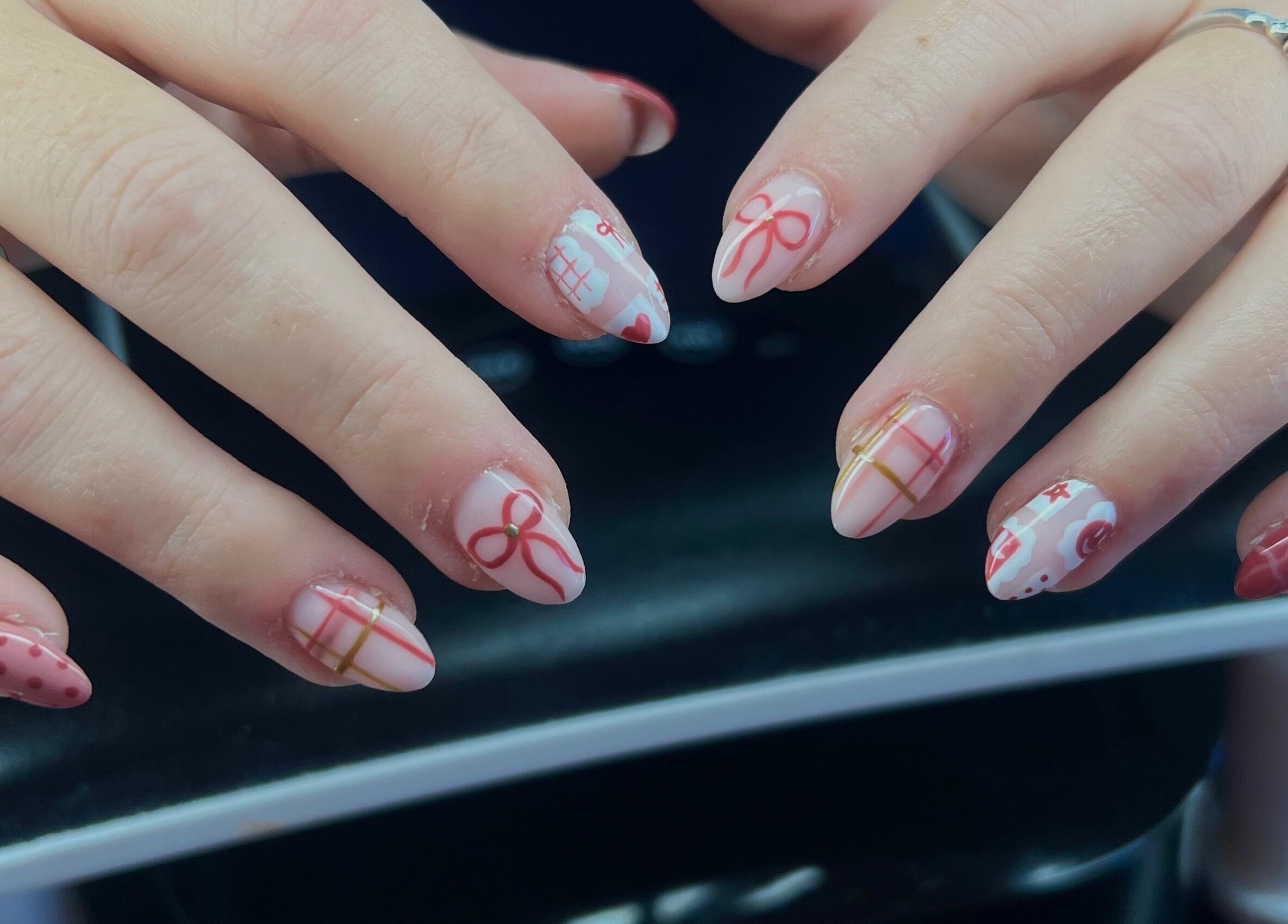 Elegant nail art with bows and patterns at Beauty By Corbyn, Boiling Springs, South Carolina, US.