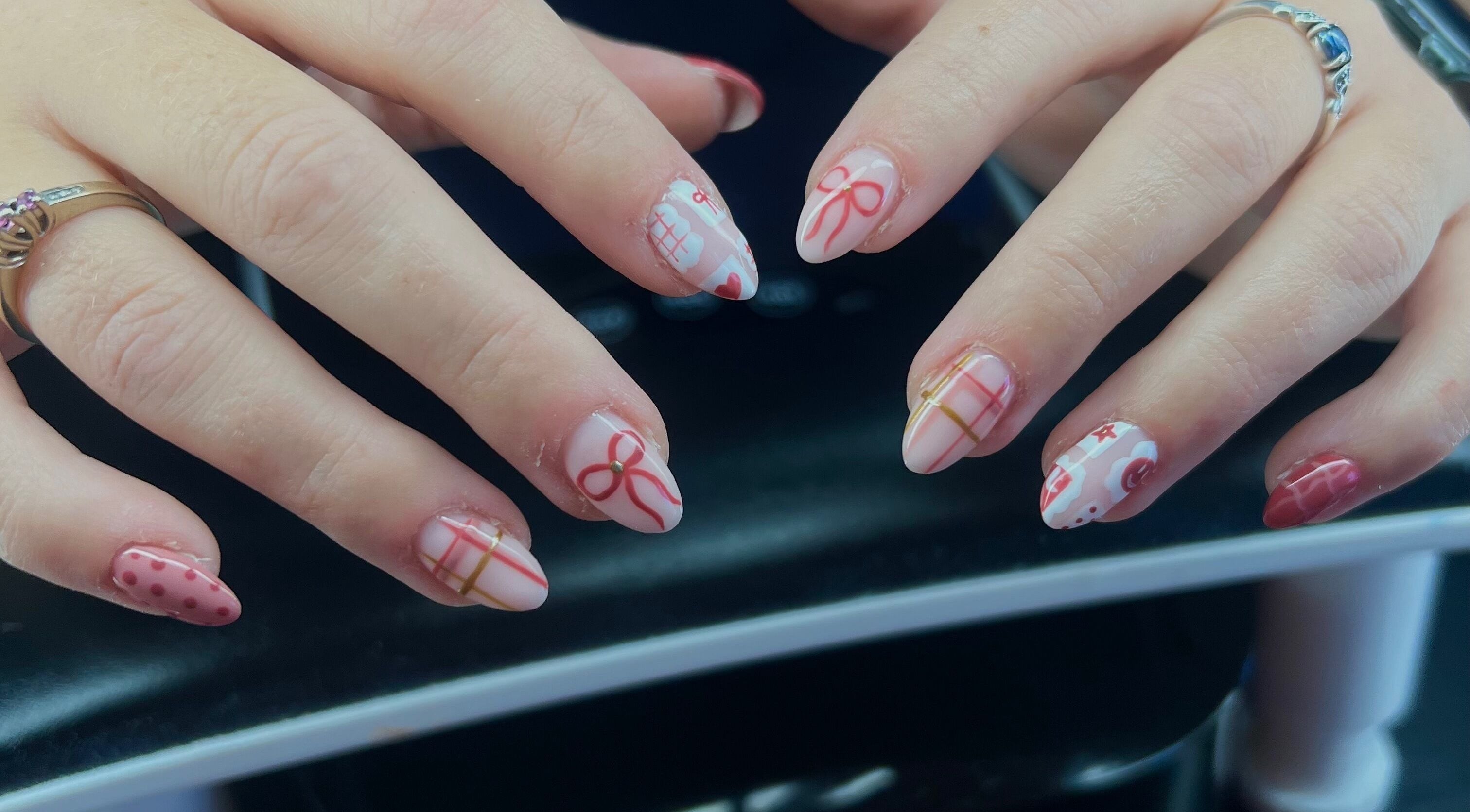 Elegant nail art with bows and patterns at Beauty By Corbyn, Boiling Springs, South Carolina, US.