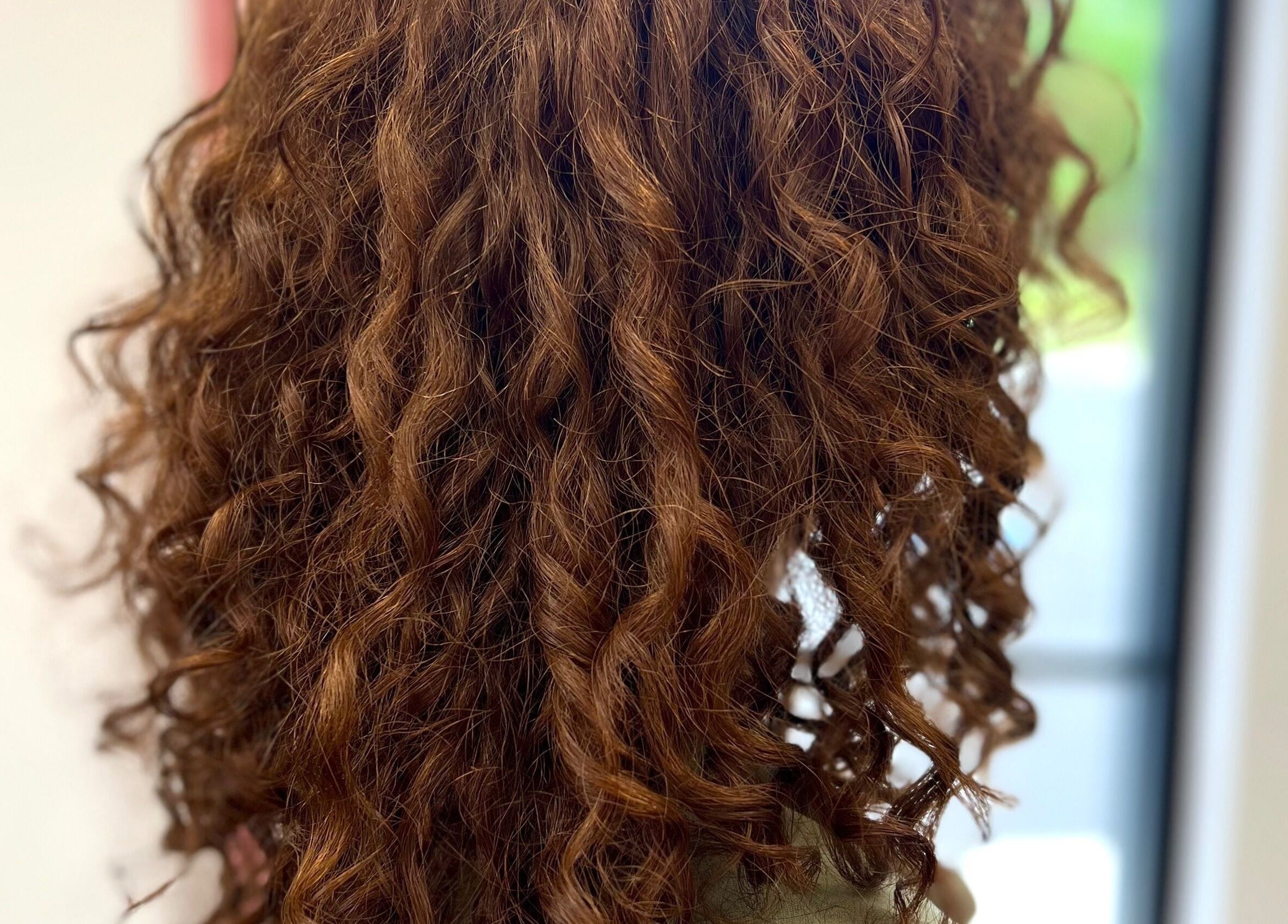 Vibrant curly hairstyle at Beauty By Corbyn in Boiling Springs, South Carolina, US.