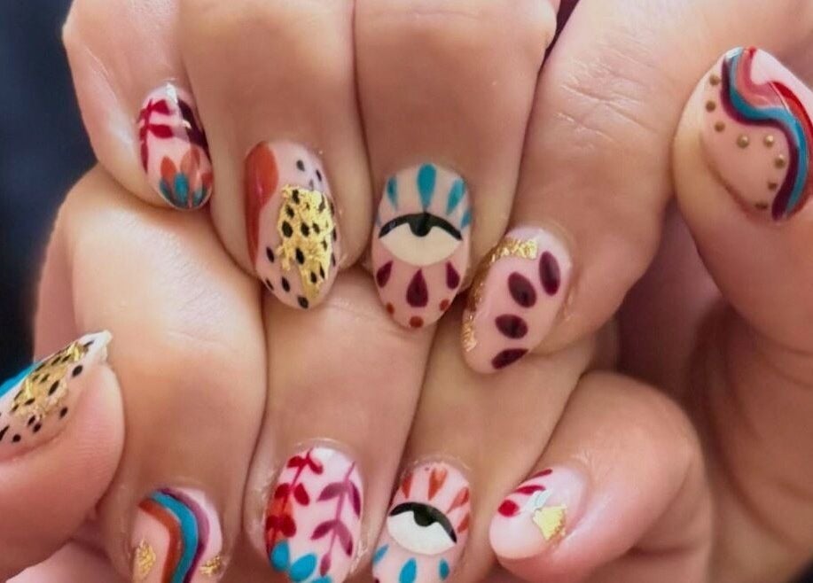 Vibrant nail art at Beauty By Corbyn, Boiling Springs, South Carolina, US. Colorful designs on manicured nails.