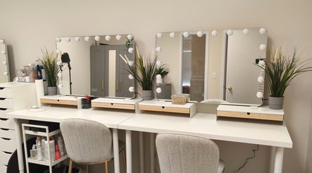 Elegant beauty station at Makeup by Inna, Edmonton, Alberta, CA, featuring mirrors and lush greenery.