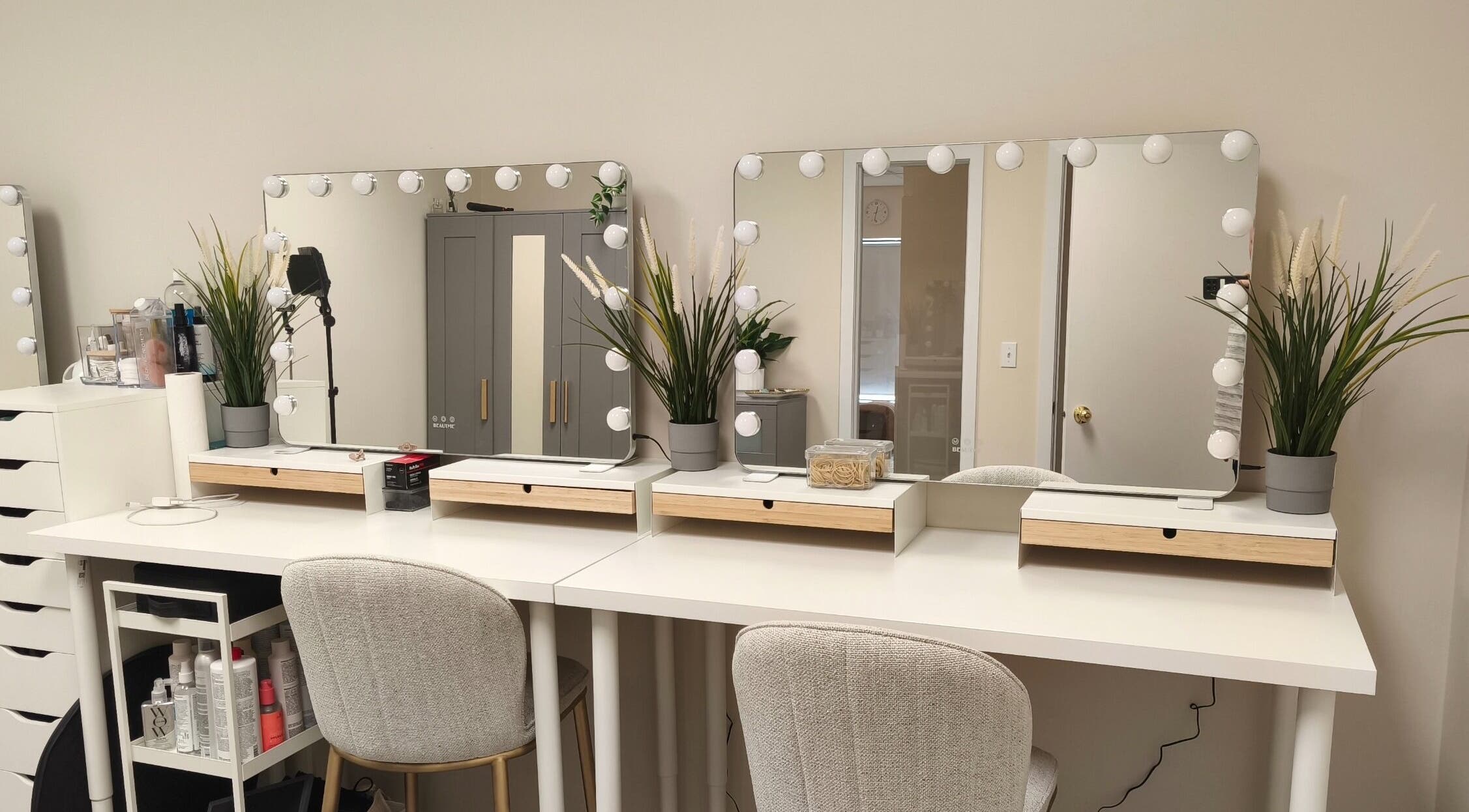 Elegant beauty station at Makeup by Inna, Edmonton, Alberta, CA, featuring chic mirrors and stylish decor.