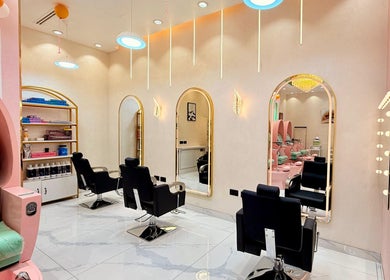 Interior view of Artika Beauty Lounge, Dubai, Dubai, AE with stylish chairs and mirrors.