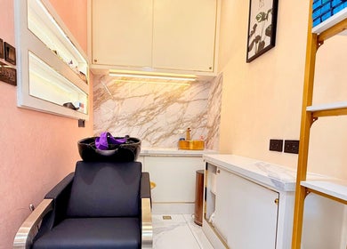 Luxurious wash station at Artika Beauty Lounge, Dubai, Dubai, AE with marble decor and cozy seating.
