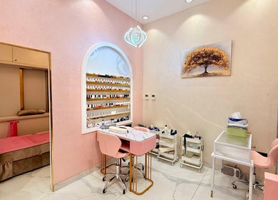 Elegant nail salon area at Artika Beauty Lounge, Dubai, Dubai, AE with chic decor and colorful polish display.