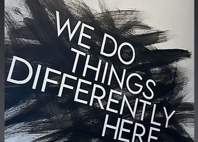 Bold statement wall at Luxe Hair Studio, Edinburgh, Scotland, GB emphasizing creativity and uniqueness.