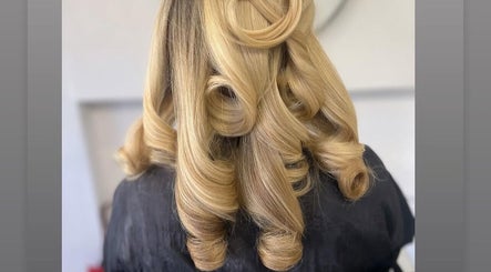 Elegant blonde curls styled at Luxe Hair Studio in Edinburgh, Scotland, GB.