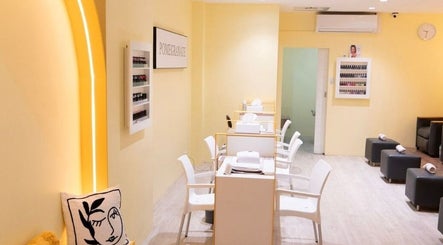 Modern spa room at Pomegranate in Cape Town, Western Cape, ZA featuring sleek manicure stations and chic decor.