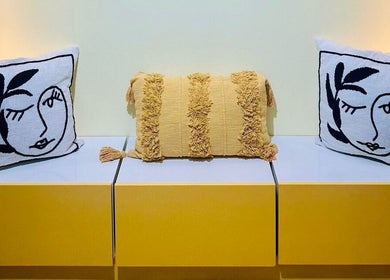 Stylish seating area with artistic cushions at Pomegranate, Cape Town, Western Cape, ZA.