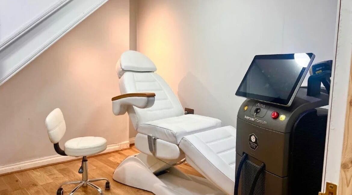 Treatment room with white chair and laser machine at The Ati Clinic, London, England, GB.