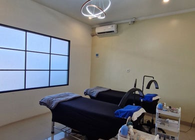 Tranquil interior of Adore Lash Studio in Bali, Bali, ID featuring two treatment beds in a minimalist setting.