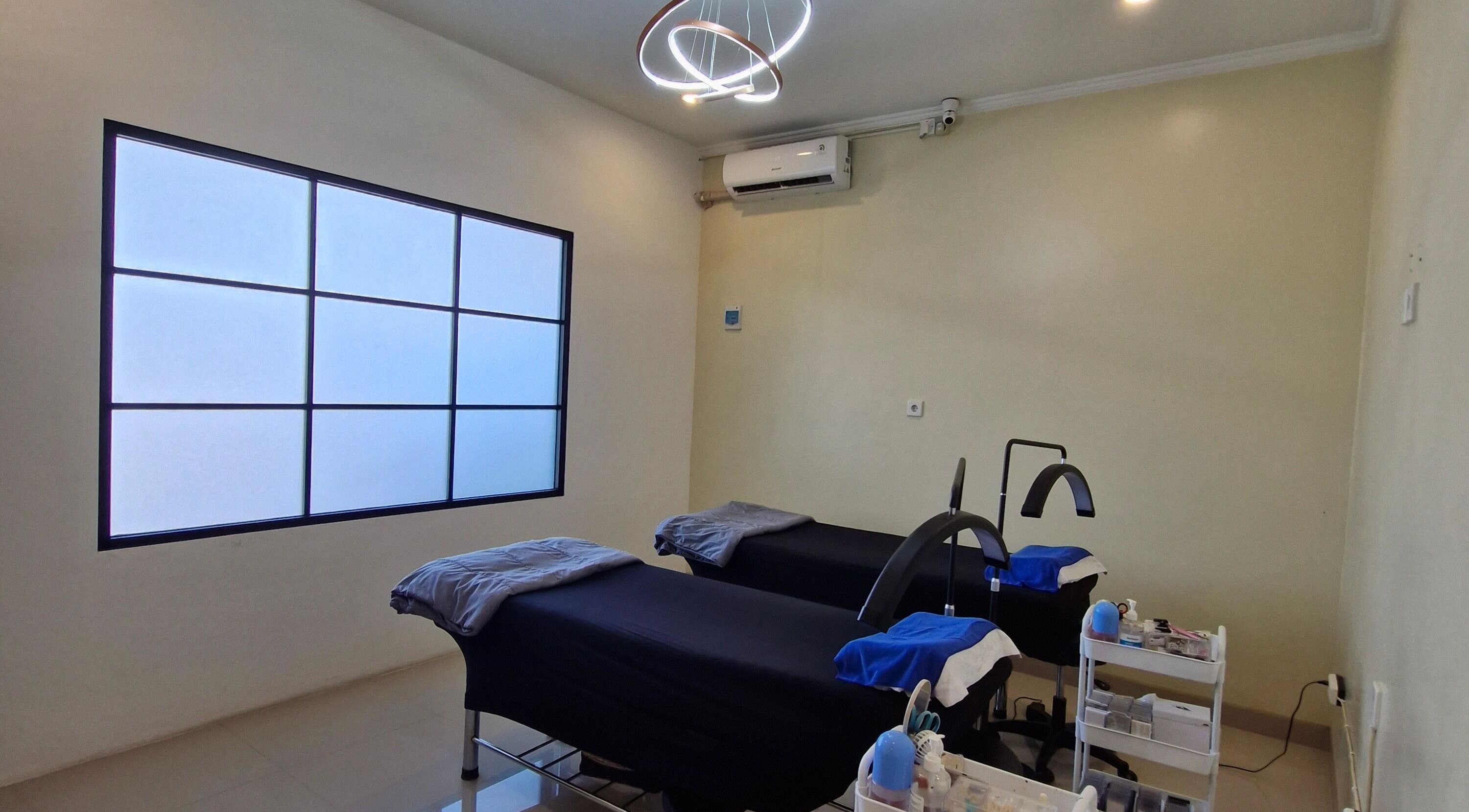 Elegant treatment room at Adore Lash Studio, Bali, Bali, ID, featuring modern decor and comfortable beds.