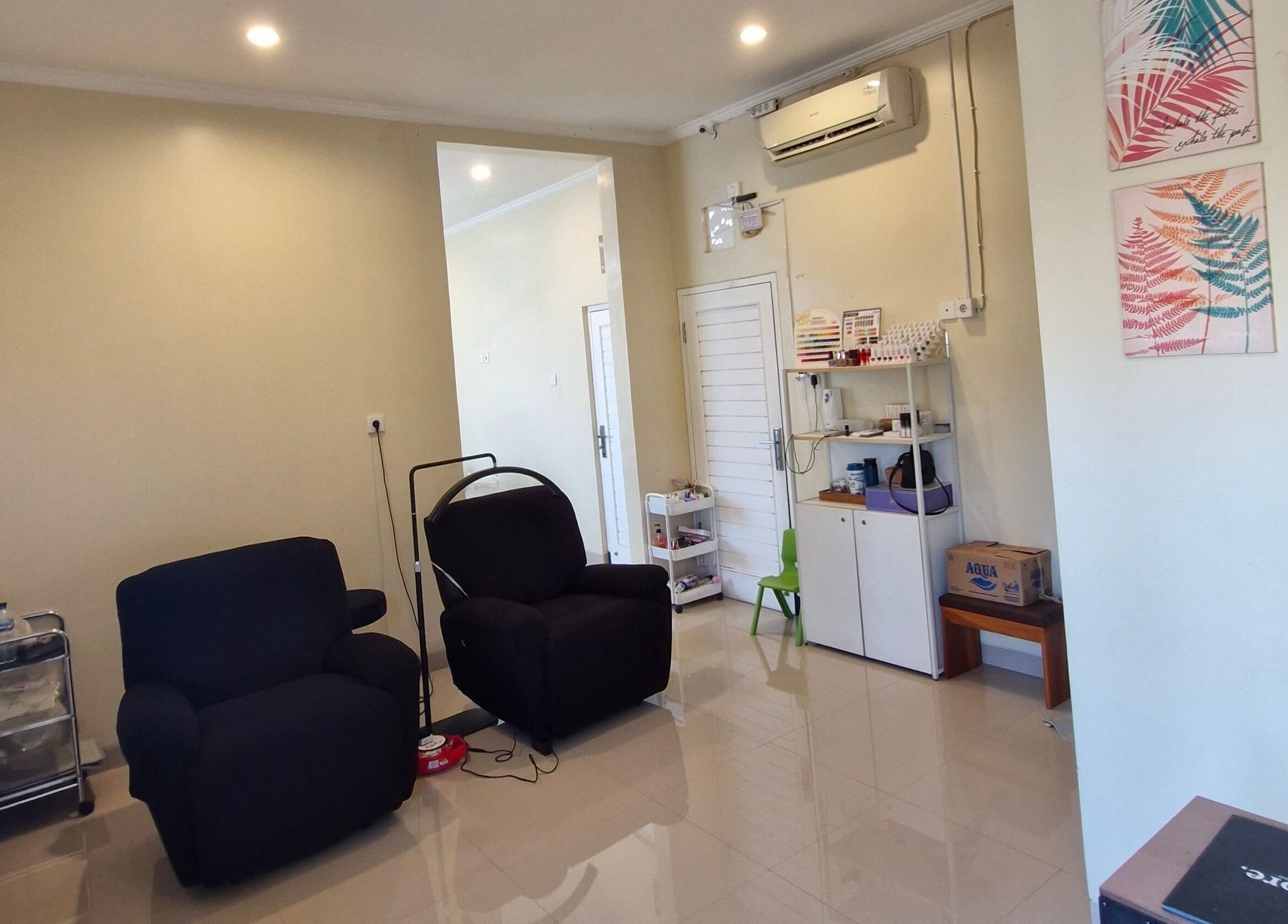 Relaxing interior of Adore Lash Studio, Bali. Comfy chairs and chic decor create a welcoming space.