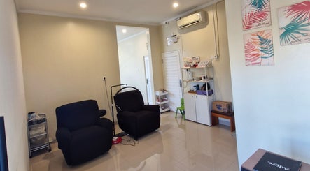 Relaxing interior of Adore Lash Studio, Bali. Comfy chairs and chic decor create a welcoming space.