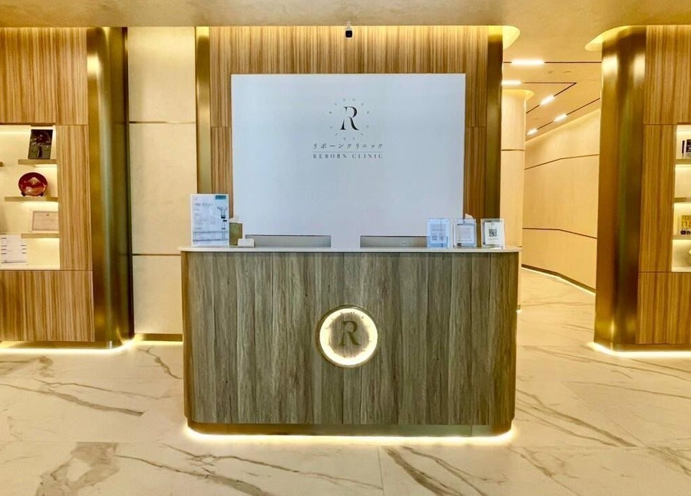 Luxurious reception at Reborn Clinic, Dubai, Dubai, AE, featuring wood paneling and ambient lighting.
