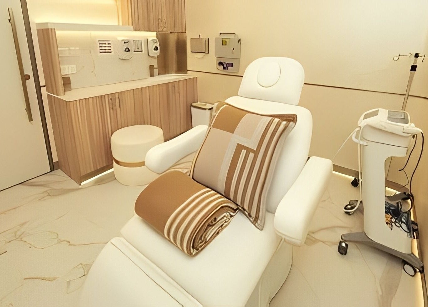 Tranquil treatment room at Reborn Clinic, Dubai, Dubai, AE, featuring plush seating and modern equipment.