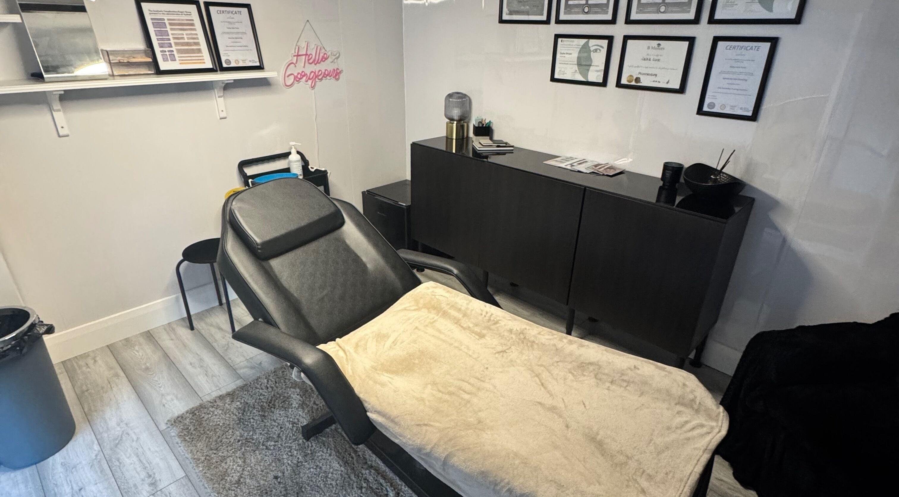 Elegant treatment room at Diamond Aesthetics in Reading, England, GB featuring modern decor and a plush bed.