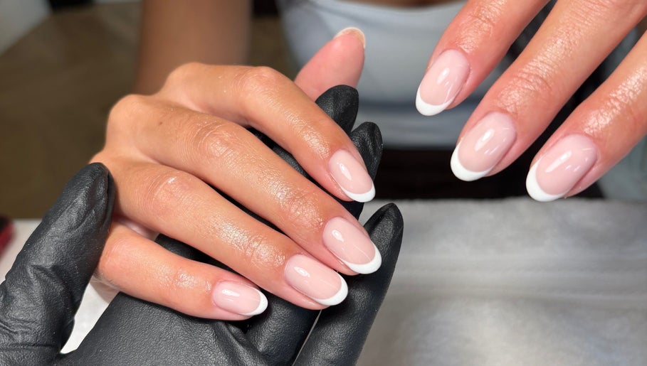 Elegant French manicure at Juicy Gels, Halifax, England, GB showcasing perfectly polished nails.