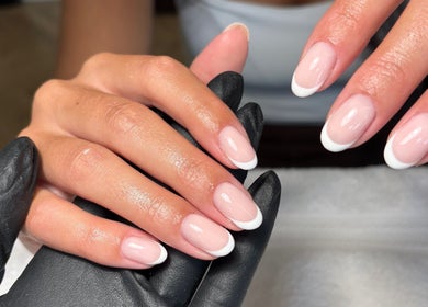 Elegant French manicure at Juicy Gels, Halifax, England, GB showcasing perfectly polished nails.