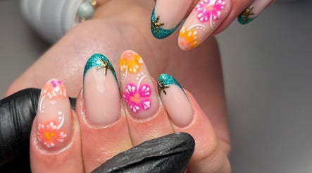 Vibrant floral nail art design at Juicy Gels in Halifax, England, GB, showcasing exquisite craftsmanship.