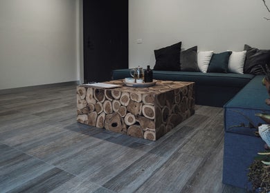 Cozy seating area at Innerverse Wellness Centre - Southbank, Melbourne, AU with wooden table.