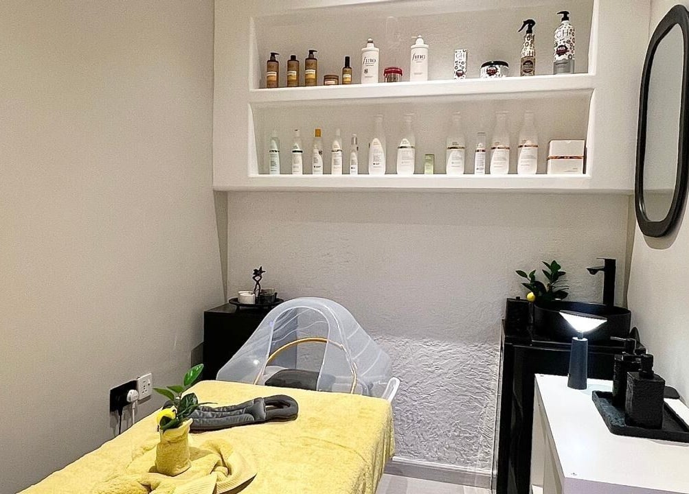 Cozy spa room at Capri Beauty Center, Sharjah, Sharjah, AE, with a treatment bed and soothing decor.
