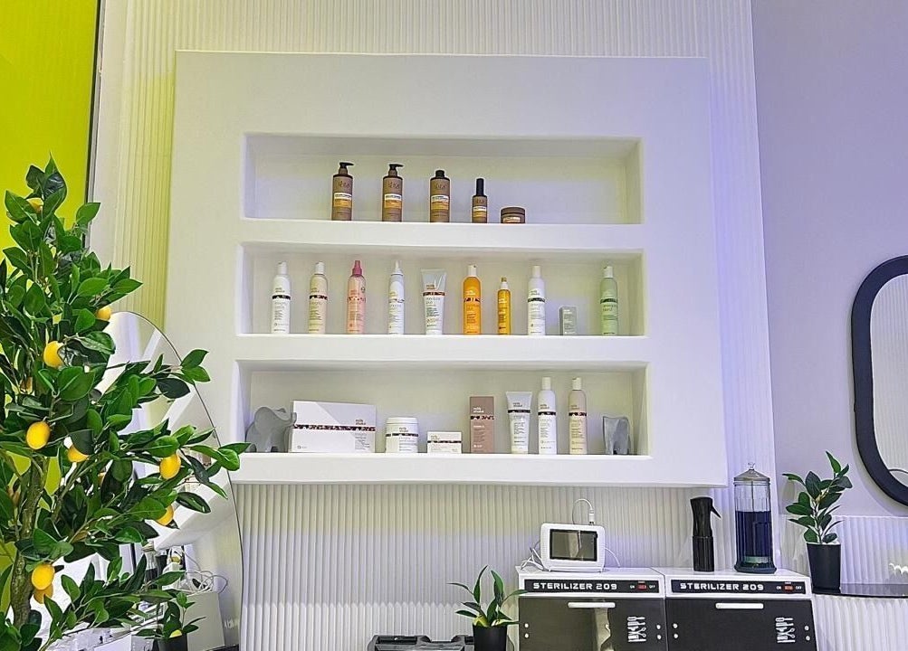 Product display at Capri Beauty Center, Sharjah, Sharjah, AE showcases premium beauty items and a lemon tree decoration.