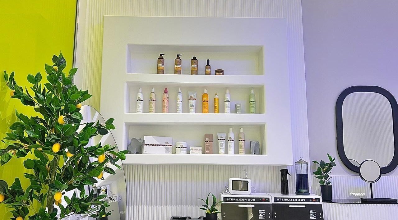 Product display at Capri Beauty Center, Sharjah, Sharjah, AE showcases premium beauty items and a lemon tree decoration.