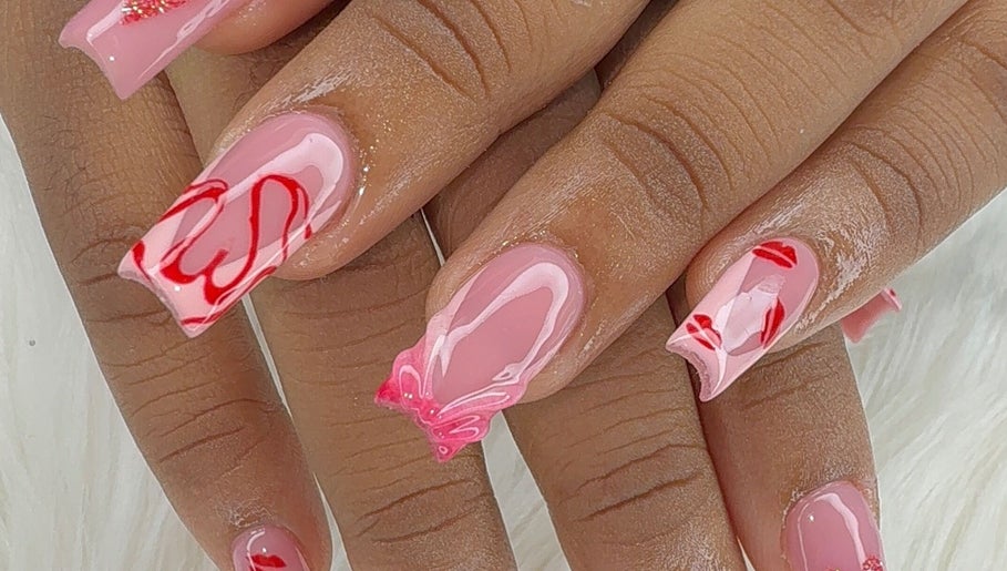 Intricate pink and red nail art at Candy’s Tips & Toes Salon & Spa, Ocho Rios, St. Ann Parish, JM.