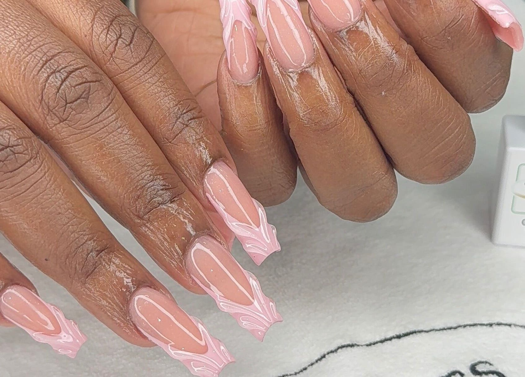 Intricate blush nail art at Candy’s Tips & Toes Salon & Spa in Ocho Rios, St. Ann Parish, JM.