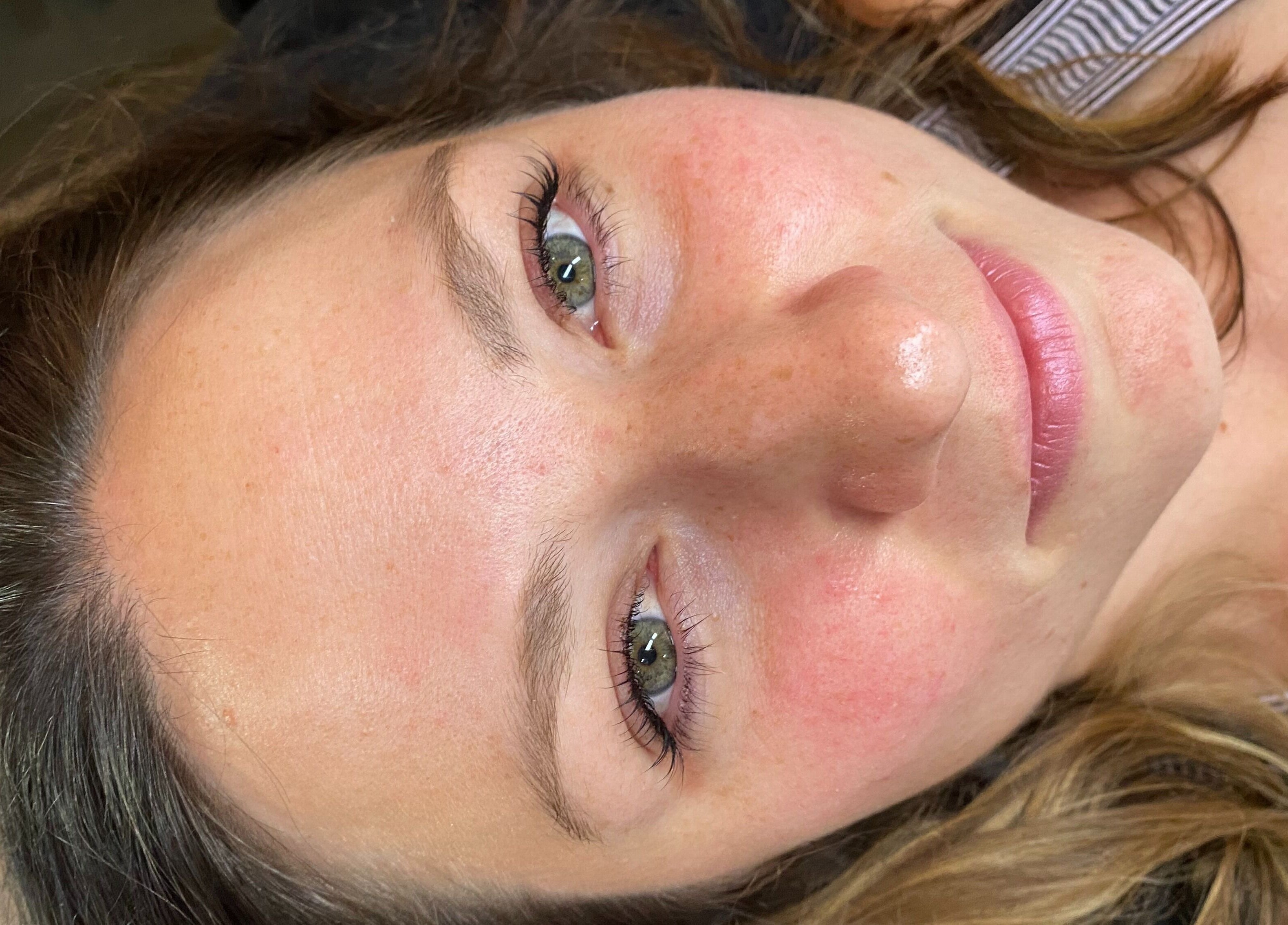 Smiling woman showcasing natural skin glow at LASHEDD in Trafalgar, Victoria, AU.