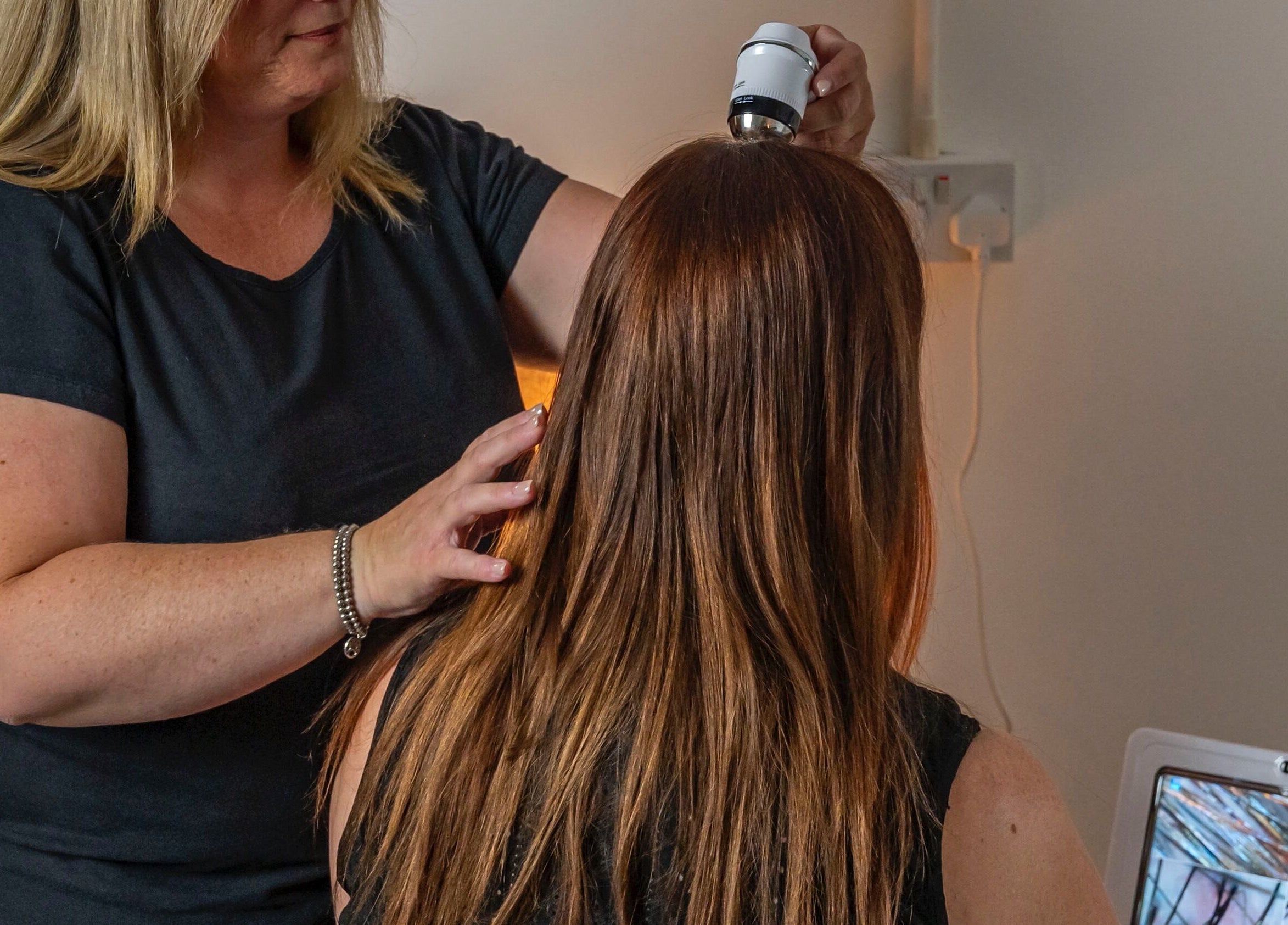 Therapist conducting scalp analysis at Blossoms Japanese Head Spa, Handforth, England, GB for holistic healing.
