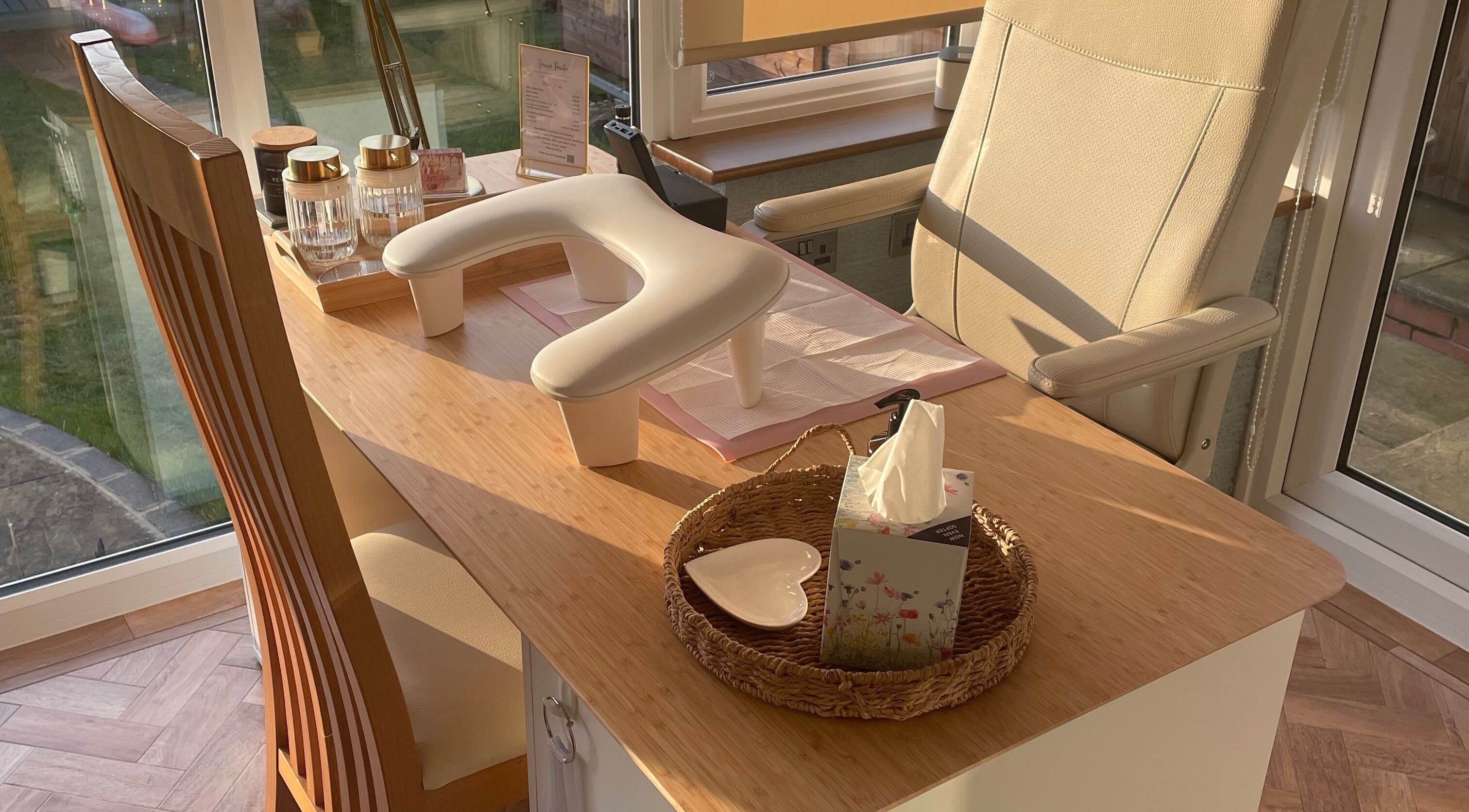 Bright nail station at Nails @ no.7, Bromsgrove, England, GB with chic decor and comfy seating.