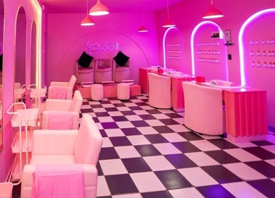 Chic interior of Kikki & Co Beauty Bar in Cape Town, Western Cape, ZA, featuring pink decor and stylish seating.
