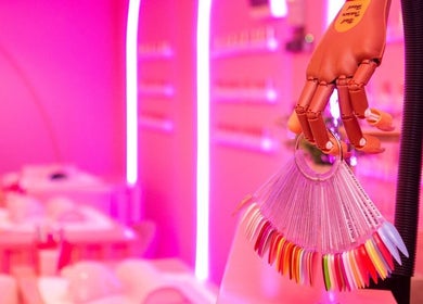 Vibrant nail selection at Kikki & Co Beauty Bar, Cape Town, Western Cape, ZA, showcasing chic pink decor.