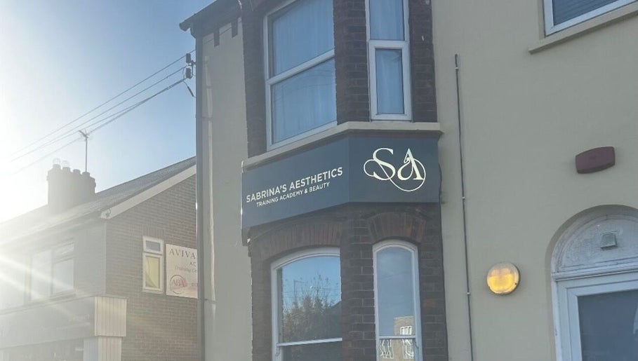Front view of Sabrina's Aesthetic Training Academy in Luton, England, featuring the academy's signage.