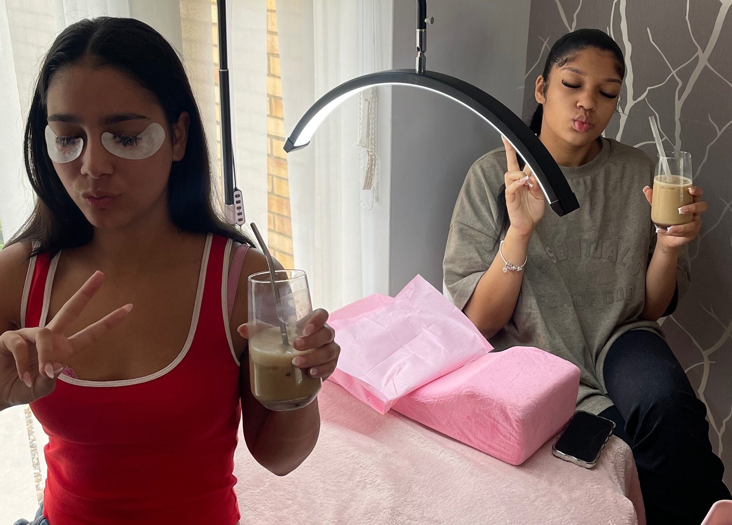 Guests enjoying drinks at Teeluxe Beauty, Potters Bar, England, GB, creating a relaxing spa atmosphere.