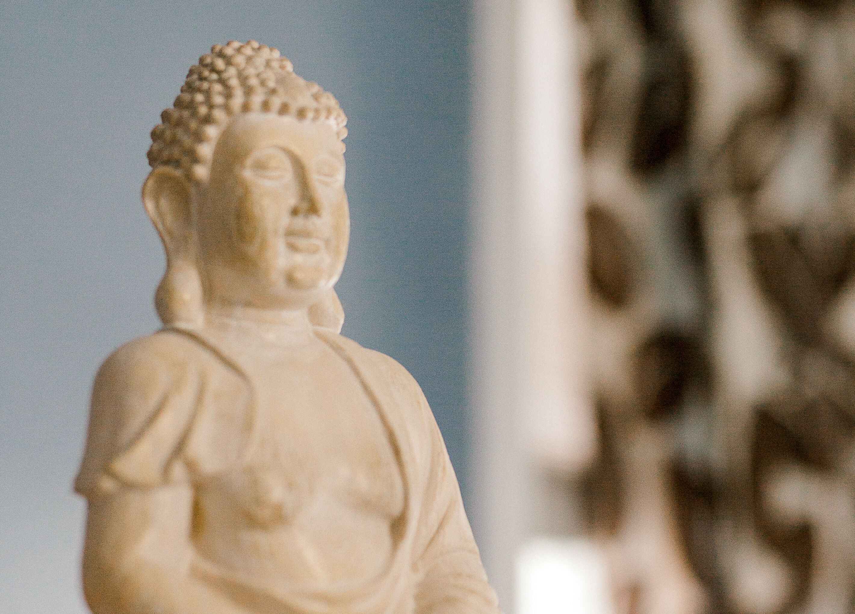 Calm Buddha sculpture at Rapis Secret, WATERDOWN, Ontario, CA, enhances the tranquil ambiance of the space.